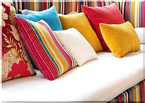 A sofa with colorful cushions for a more welcoming home