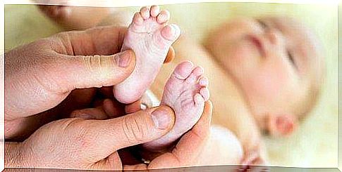 parent massaging their baby to ease abdominal pain