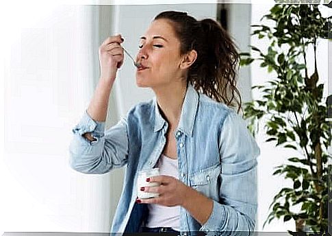 A woman eating healthy yogurt