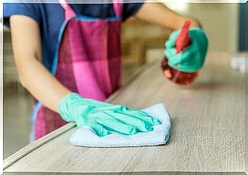 A person using their own furniture cleaner