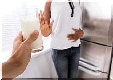 A woman who says no to a glass of milk. 