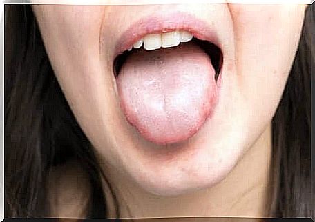 A woman showing her tongue. 